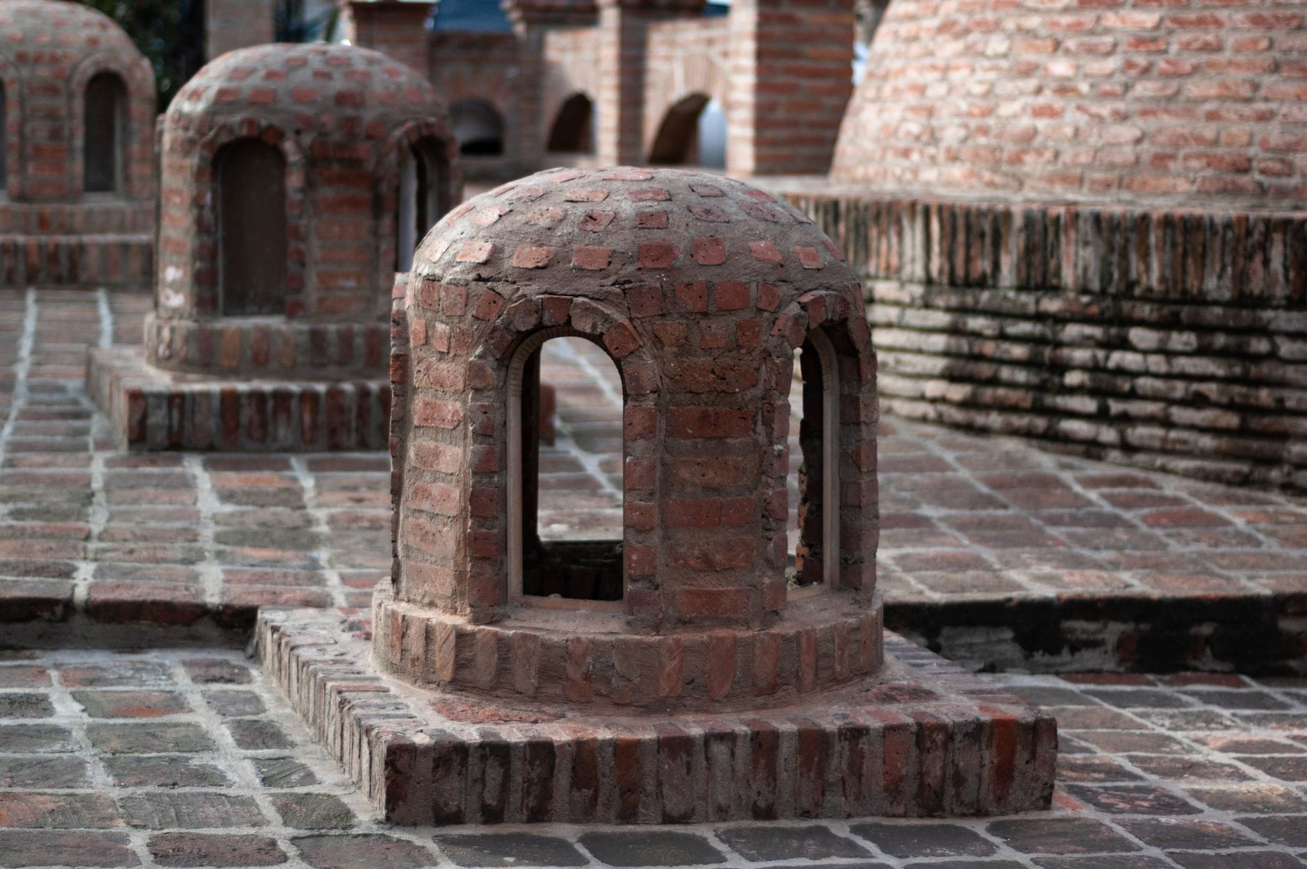 Detailed view of traditional brick chimneys in Tbilisi, Georgia showcasing unique architectural style.